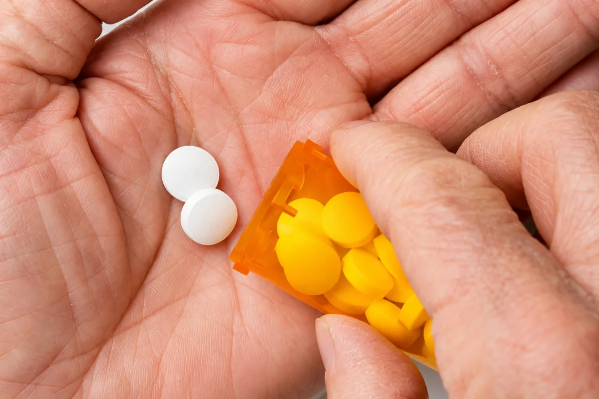 Gauze and a medication bottle on a tray