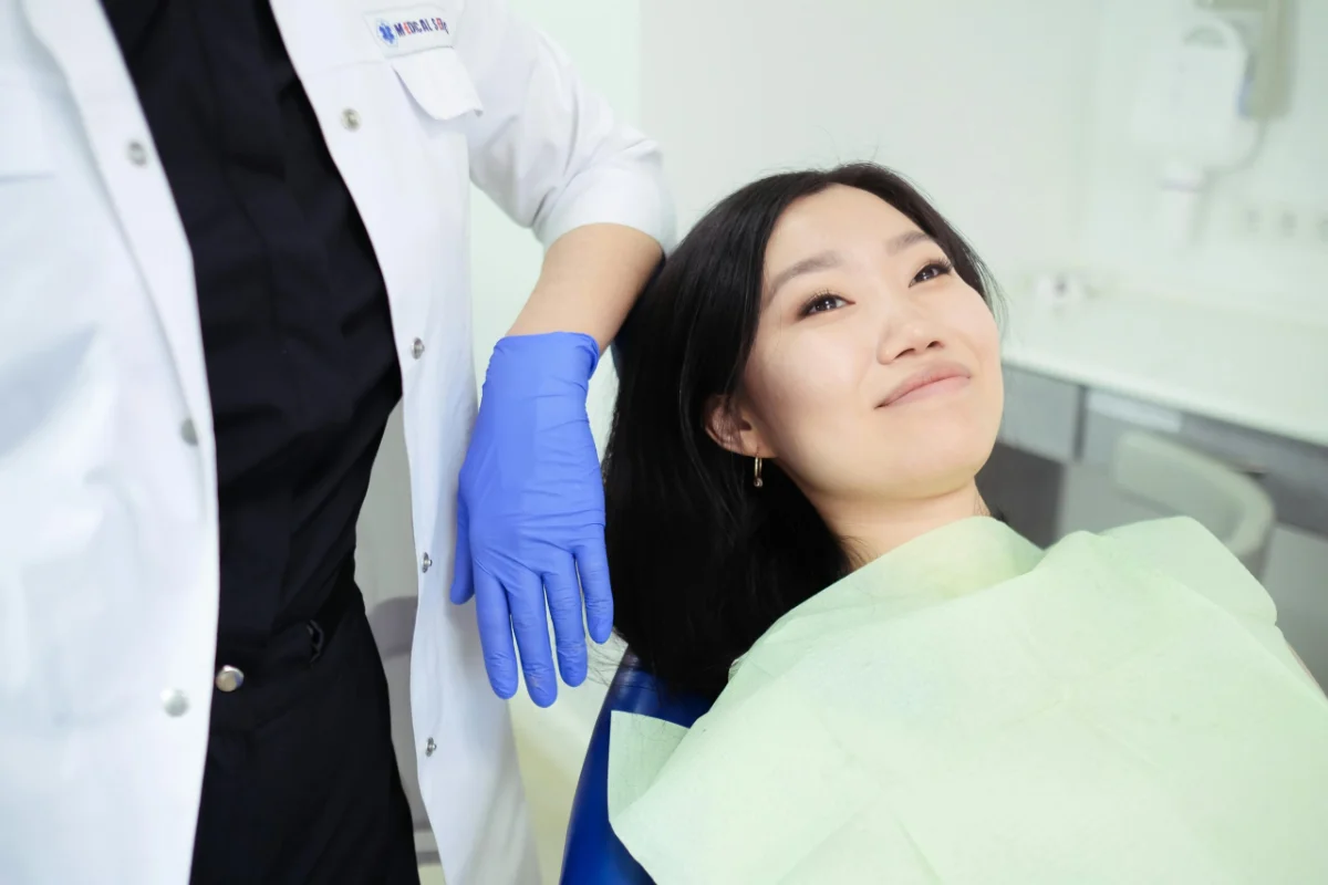 Dr. Monique Sison reviewing a scan with a patient at mend dental