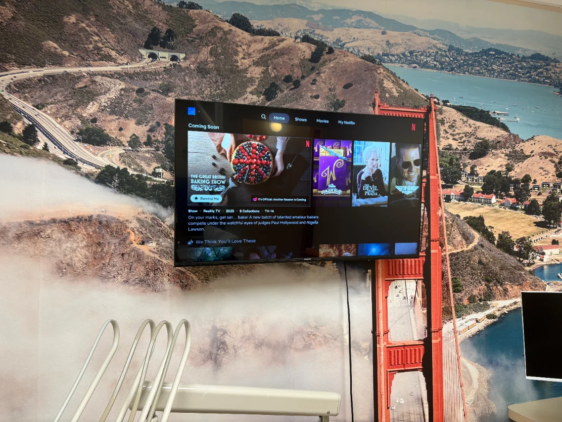 Netflix playing on a treatment room TV at mend dental