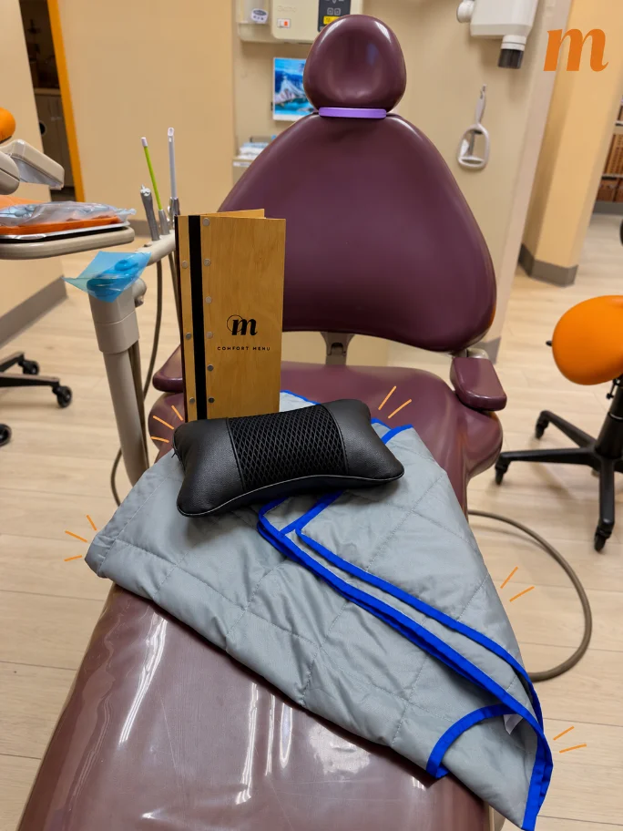 Blanket and neck pillow ready in a treatment room